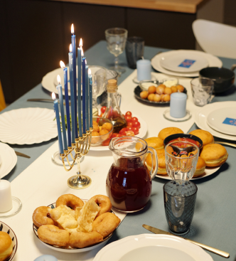 Intimate birthday dinner table with candles and shared dishes