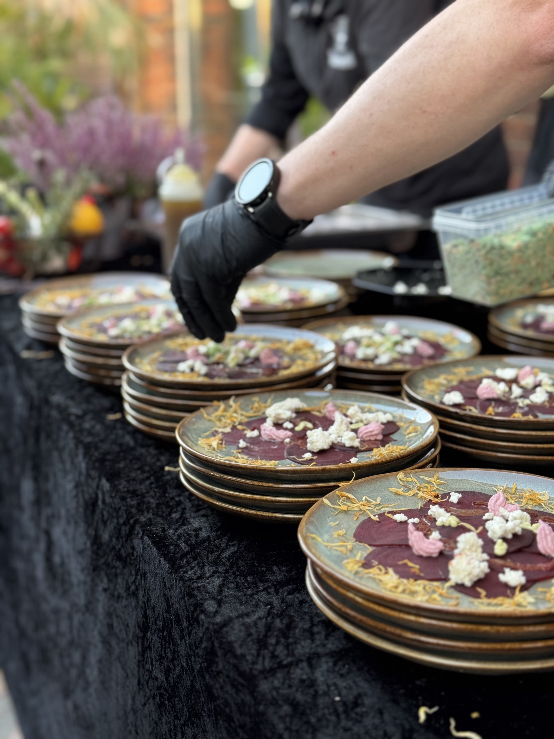 Chef preparing food over open fire
