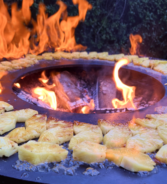 Cheese grilling around an open fire