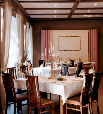 Elegant set wedding tables in a warm dining room